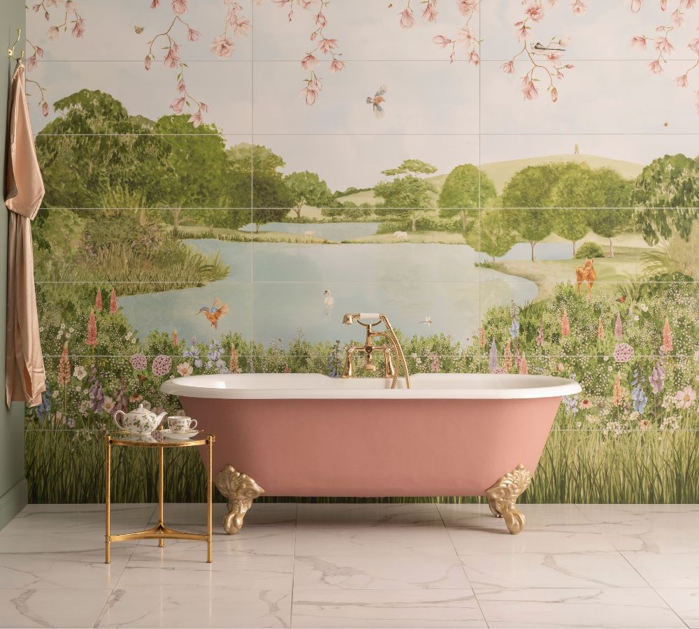 A freestanding bath with scenic tile of lake and trees.